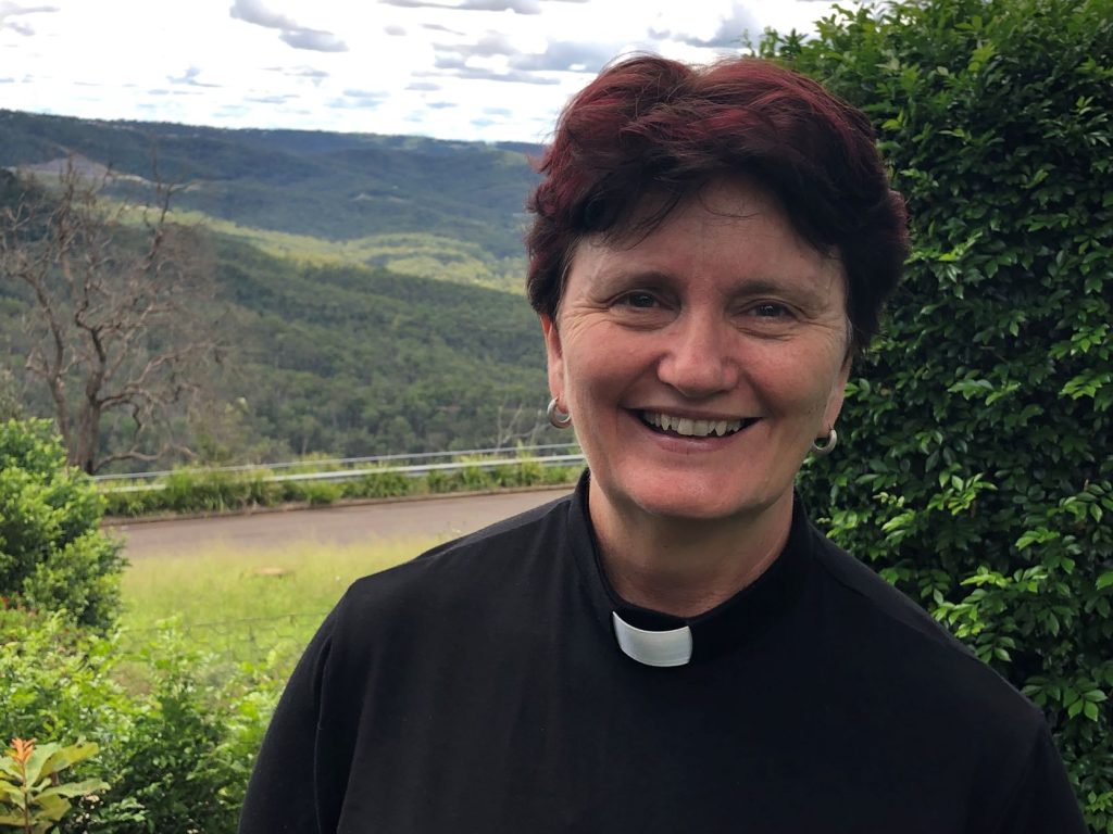 The Rev’d Melissa Conway at Prince Henry Heights, with the Great Dividing Range in the background