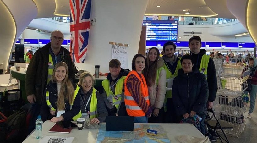 A team from the charity Investing in People and Culture at Warsaw Central railway station