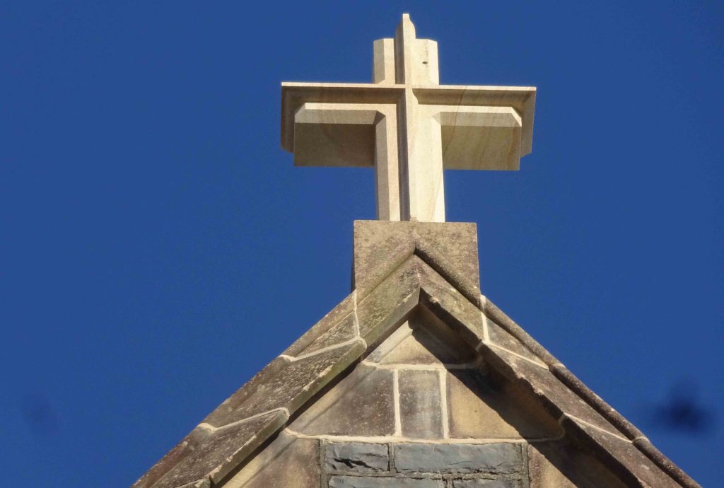 New sandstone cross on the eastern apex