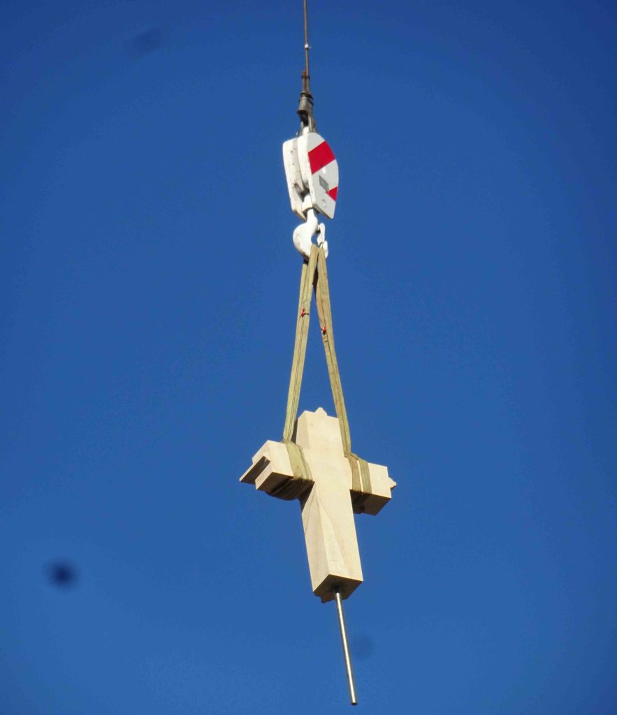 ”Flying cross” being lifted into place on the eastern apex