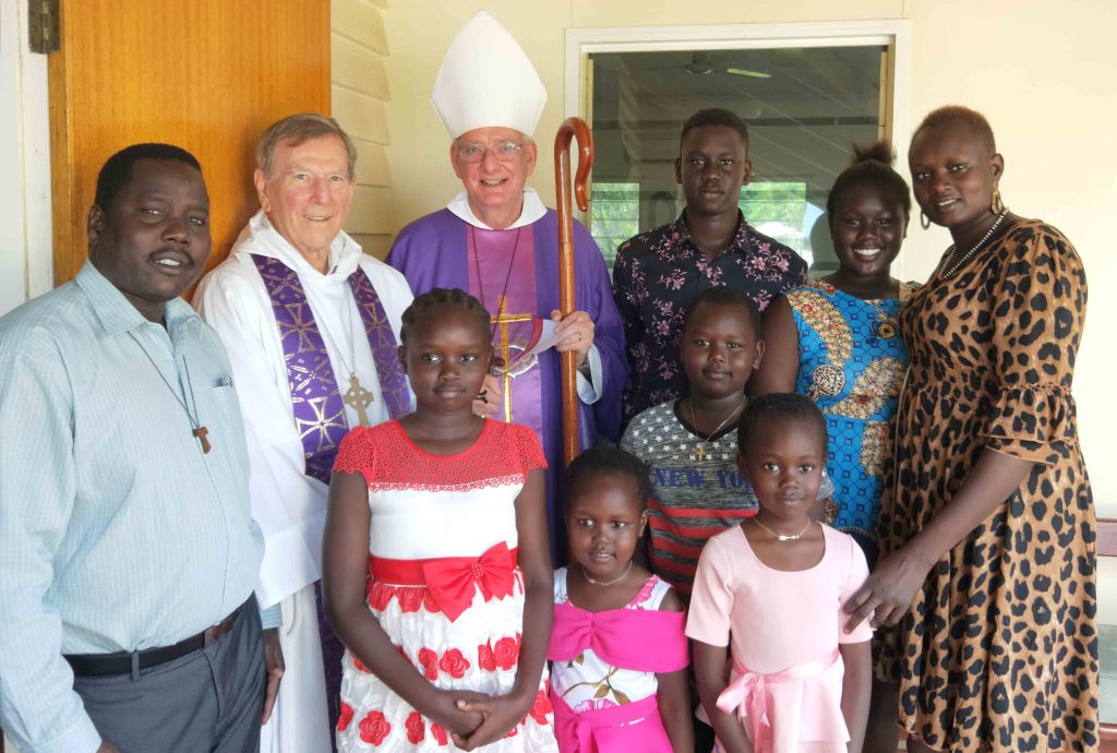 Peter Jongkuch with family and senior clergy