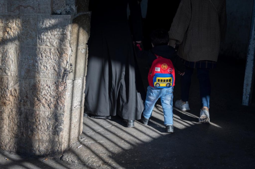 A young boy and two women enter checkpoint 300 in Bethlehem 