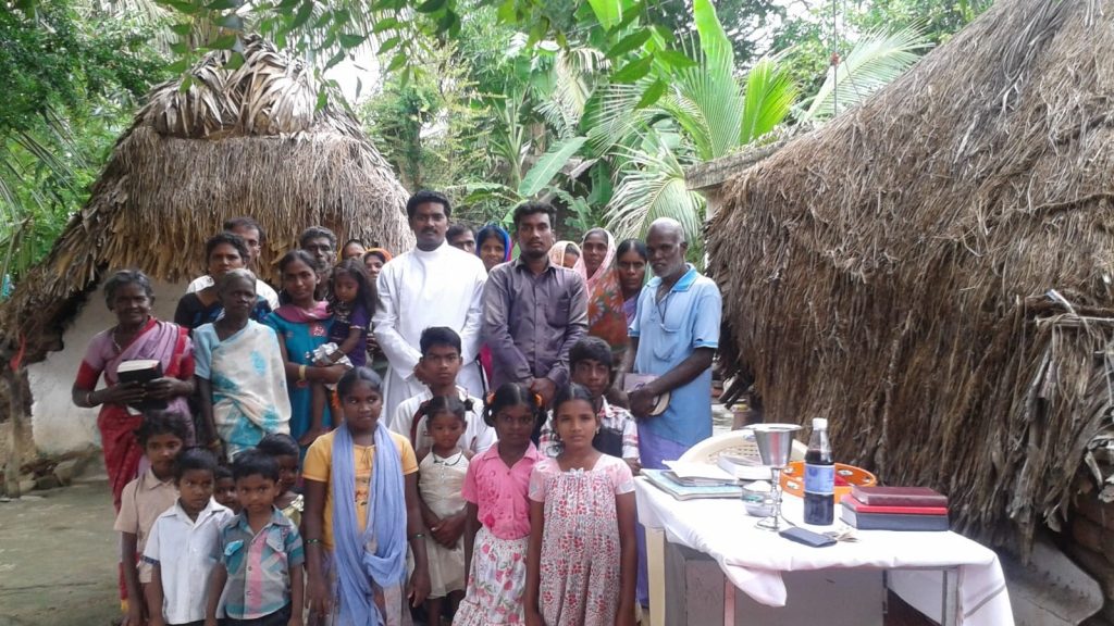 The Rev'd Sam Sigamani and parishioners in South India