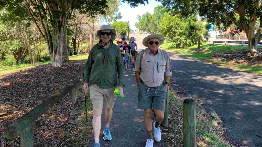 Bishop John Roundhill and pilgrims walk two-by-two past Glindemann Park, between Mt Gravatt and Holland Park