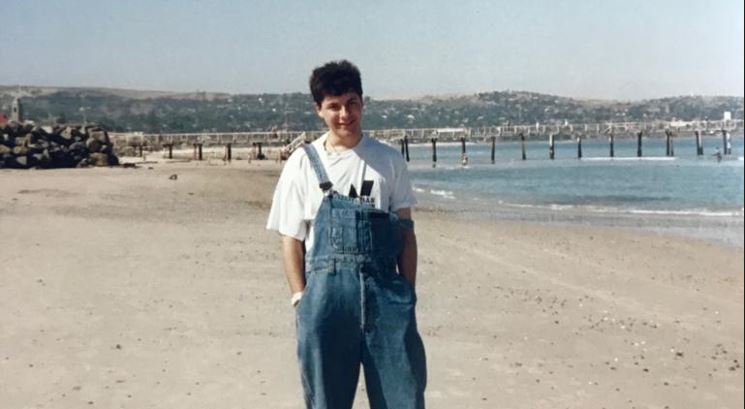 A teenage Bishop Jeremy Greaves showing contemporary teens how to wear overalls 1990s-style