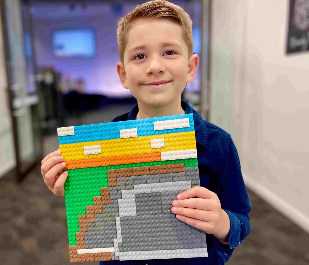 Theodore Lowe with Lego art depicting the empty tomb
